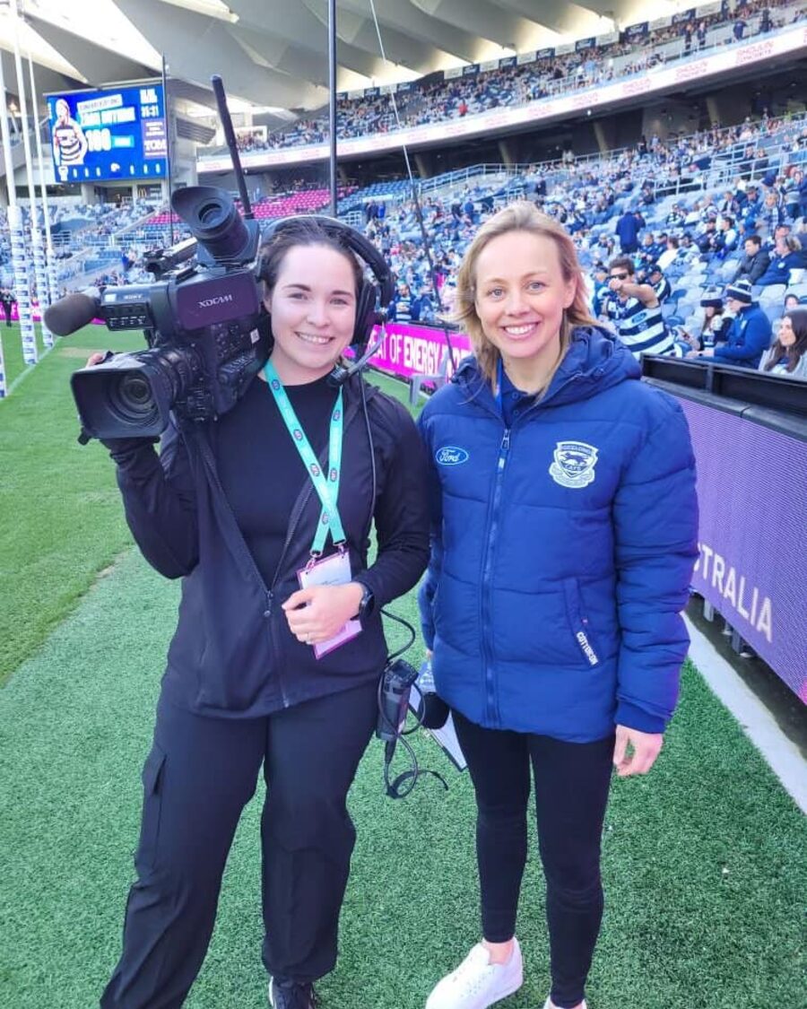 Laura filming with a broadcast camera at the Cats' home stadium in Geelong