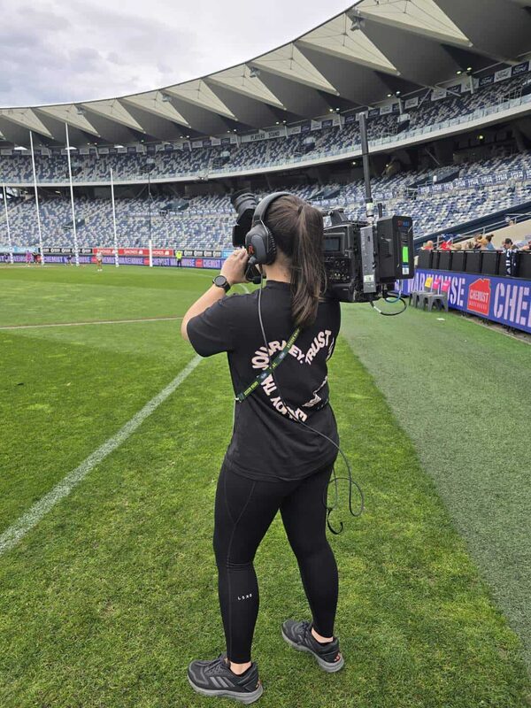 Laura working as an RF camera operator at the Geelong Cats